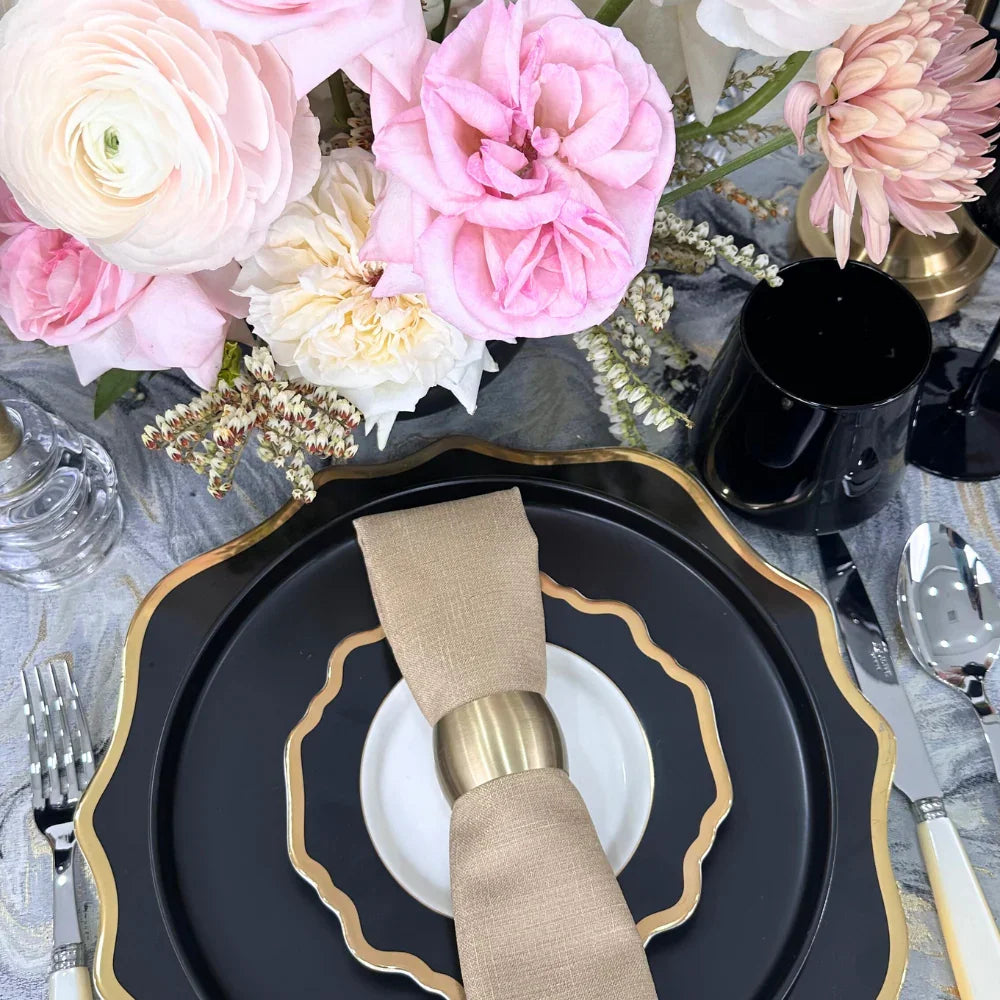 Opulent Twilight-Dining Setup featuring a table setting with floral centerpieces, Sabre cutlery, elegant tableware, and black chairs, perfect for hosting eight guests.