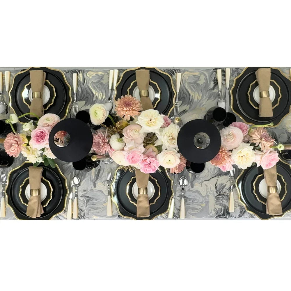 Opulent Twilight-Dining Setup with plates, Sabre cutlery, napkins, and flower centerpieces arranged on a table, designed for an elegant gathering of eight guests.