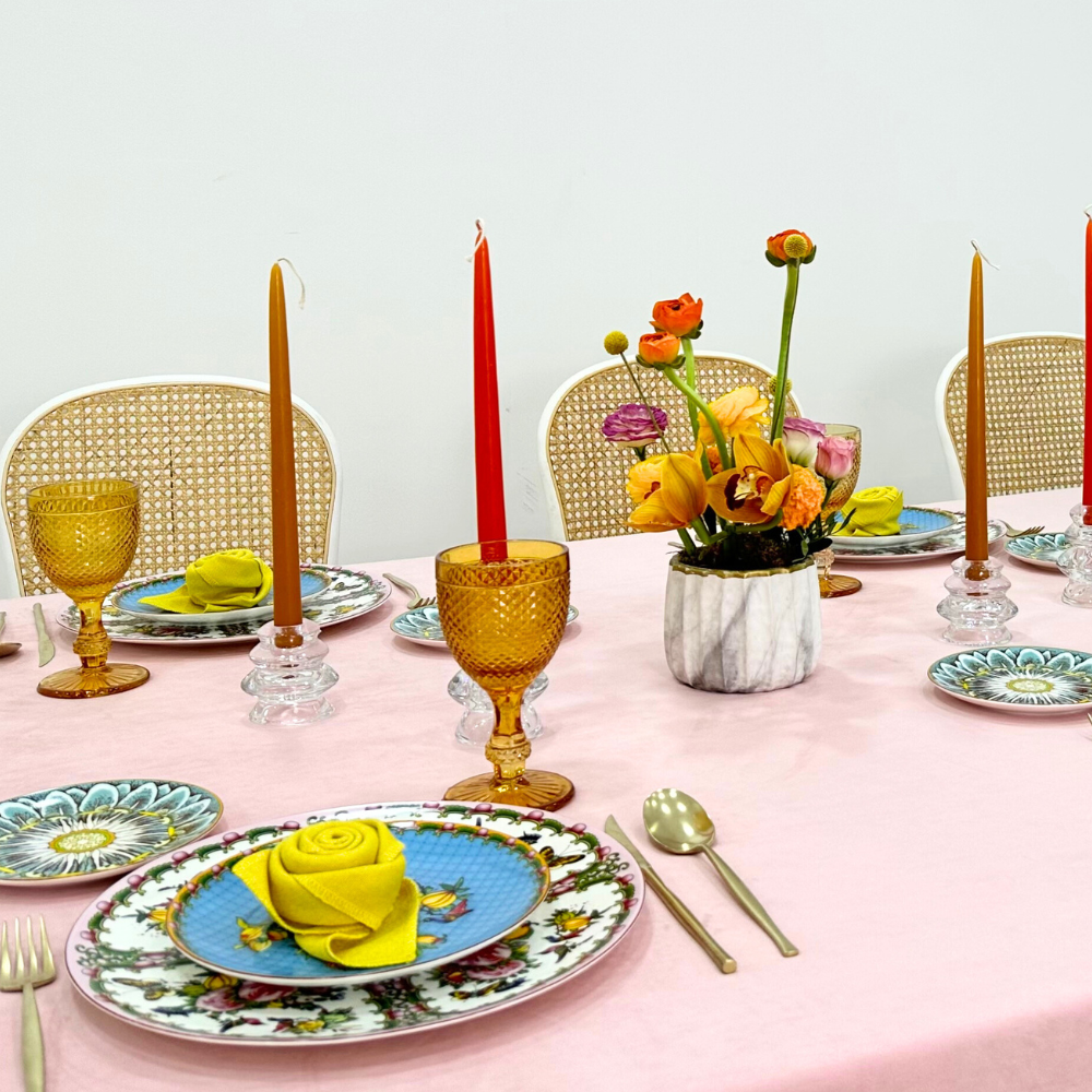 Blush Velvet Dreams-Dining Setup: Elegant table with plates, cutlery, and napkins arranged for eight guests, featuring candle holders and floral centerpieces. Perfect for special occasions.