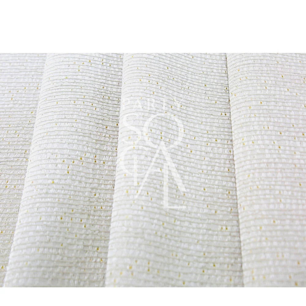 TEXTURED IVORY FABRIC WITH GOLD SPECS: Close-up of an off-white, ribbed textile with metallic-gold flecks, showcasing gentle folds, ideal for elegant event decor.