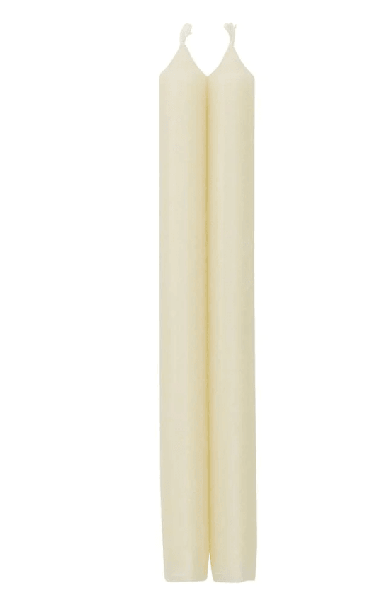 Two white crown candles in a candlestick holder.