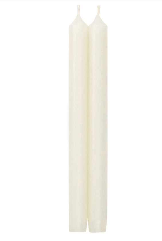 Two white crown candles on display.