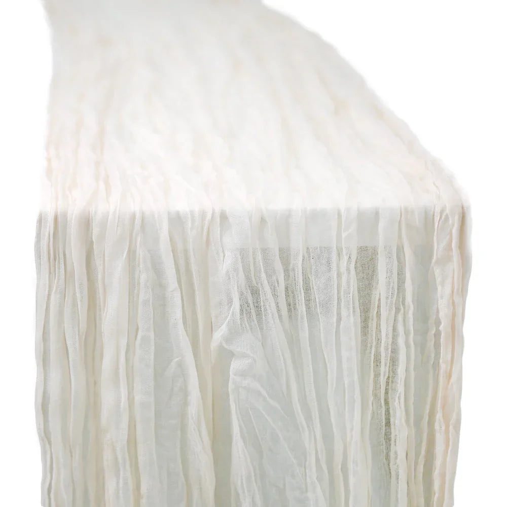 GAUZE TABLE RUNNERS with ruffled edges, perfect for elegant special occasions, enhance dining setups with a creased effect for a unique style.