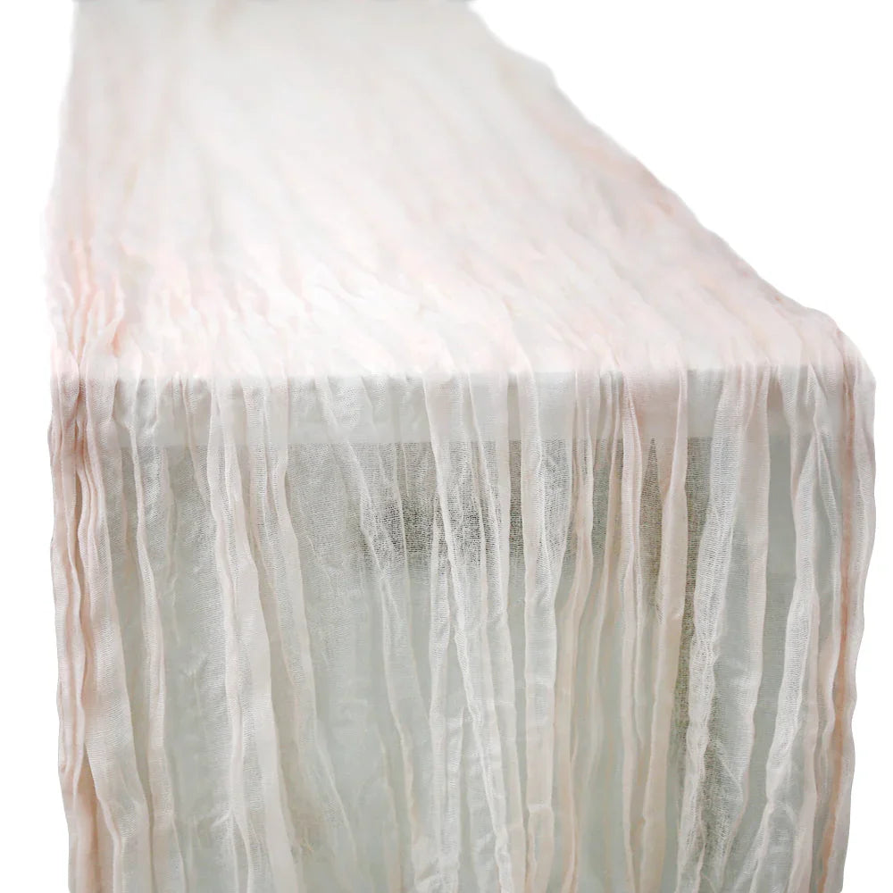 GAUZE TABLE RUNNERS elegantly draped over a table, showcasing a premium creased texture, ideal for enhancing any special occasion&