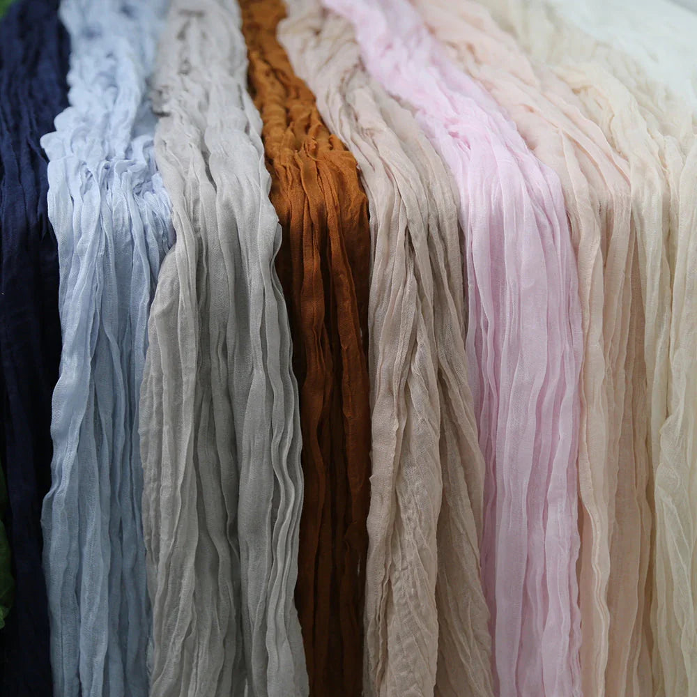 GAUZE TABLE RUNNERS displayed, showcasing their premium creased texture, ideal for adding elegance to special occasion tabletops.
