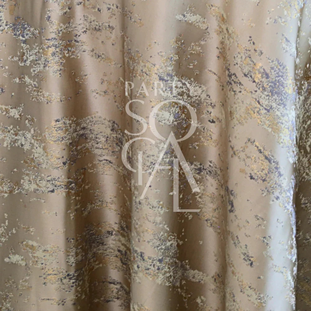 Champagne Distressed Metallic Tablecloth with a silver-and-gold abstract pattern on satin, featuring the PARTY SOCIAL logo, ideal for upscale, contemporary events.