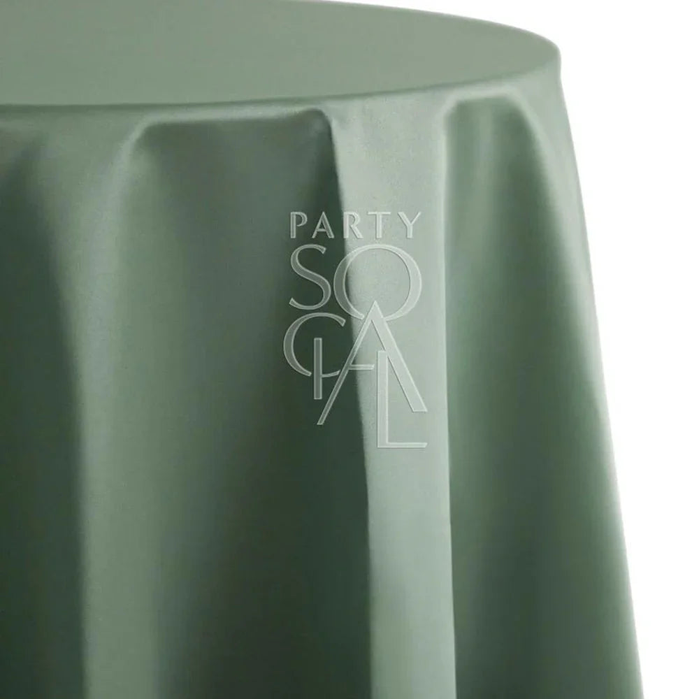 Round satin tablecloth for special occasions, shown on a table with a logo detail. Ideal for weddings and events.