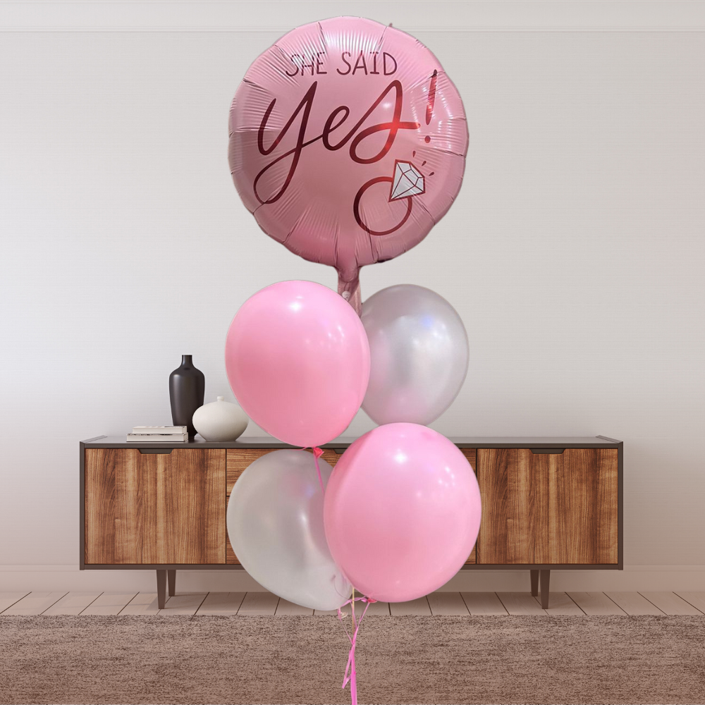 Floating on Yes Helium Balloon Bouquet featuring pink and white balloons with “She said yes!” centerpiece, perfect for engagements and celebrations from Party Social.