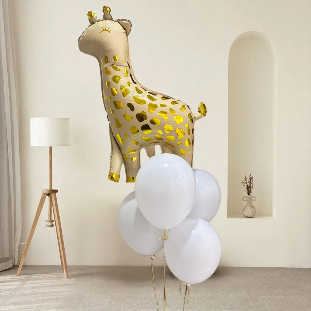 Giraffe Helium Balloon Bouquet in a minimalist room, featuring four white balloons and a gold giraffe balloon, creating a festive atmosphere.