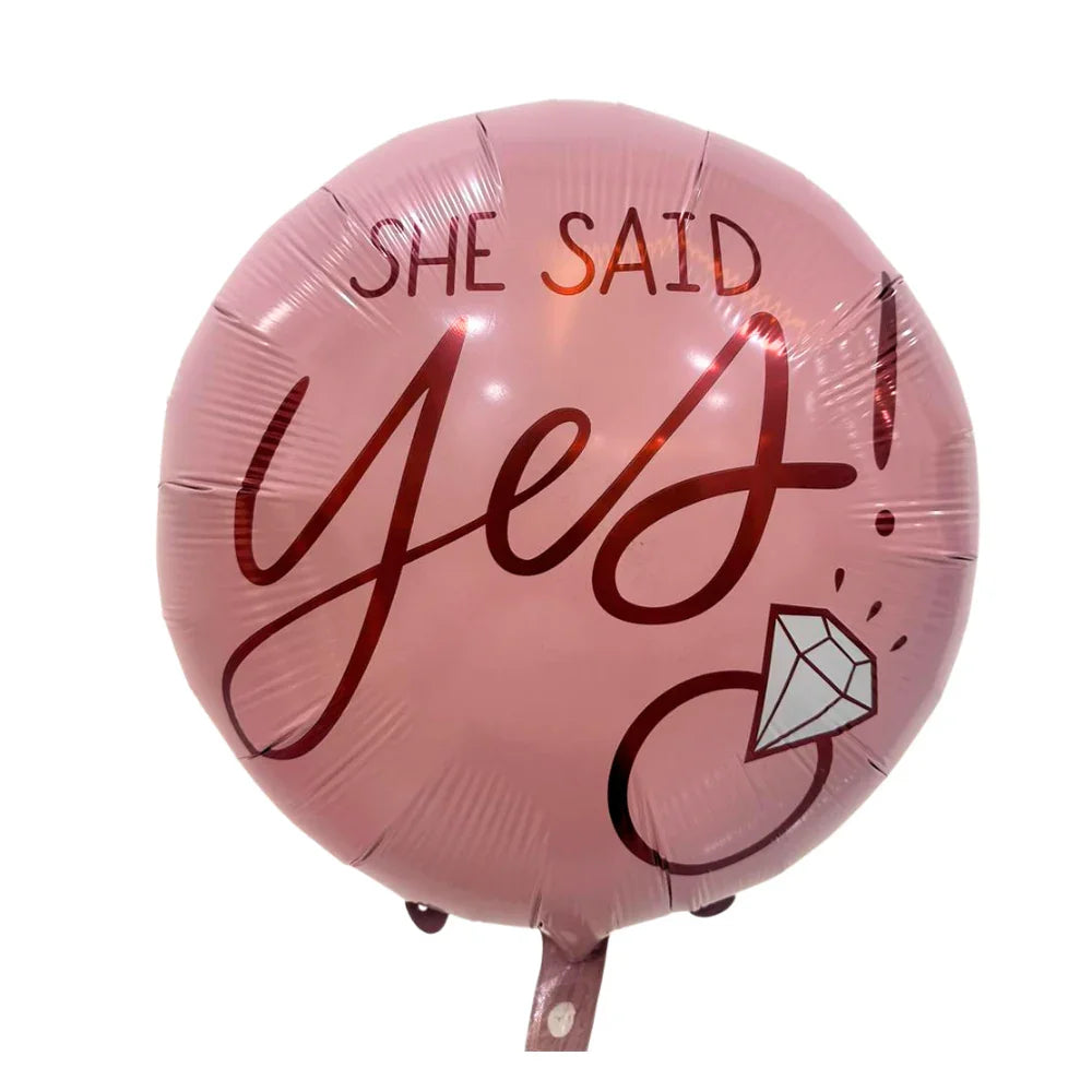 She Said Yes Foil Balloon featuring bold script and diamond-ring illustration, ideal for celebrating engagements and bridal events with a festive touch.