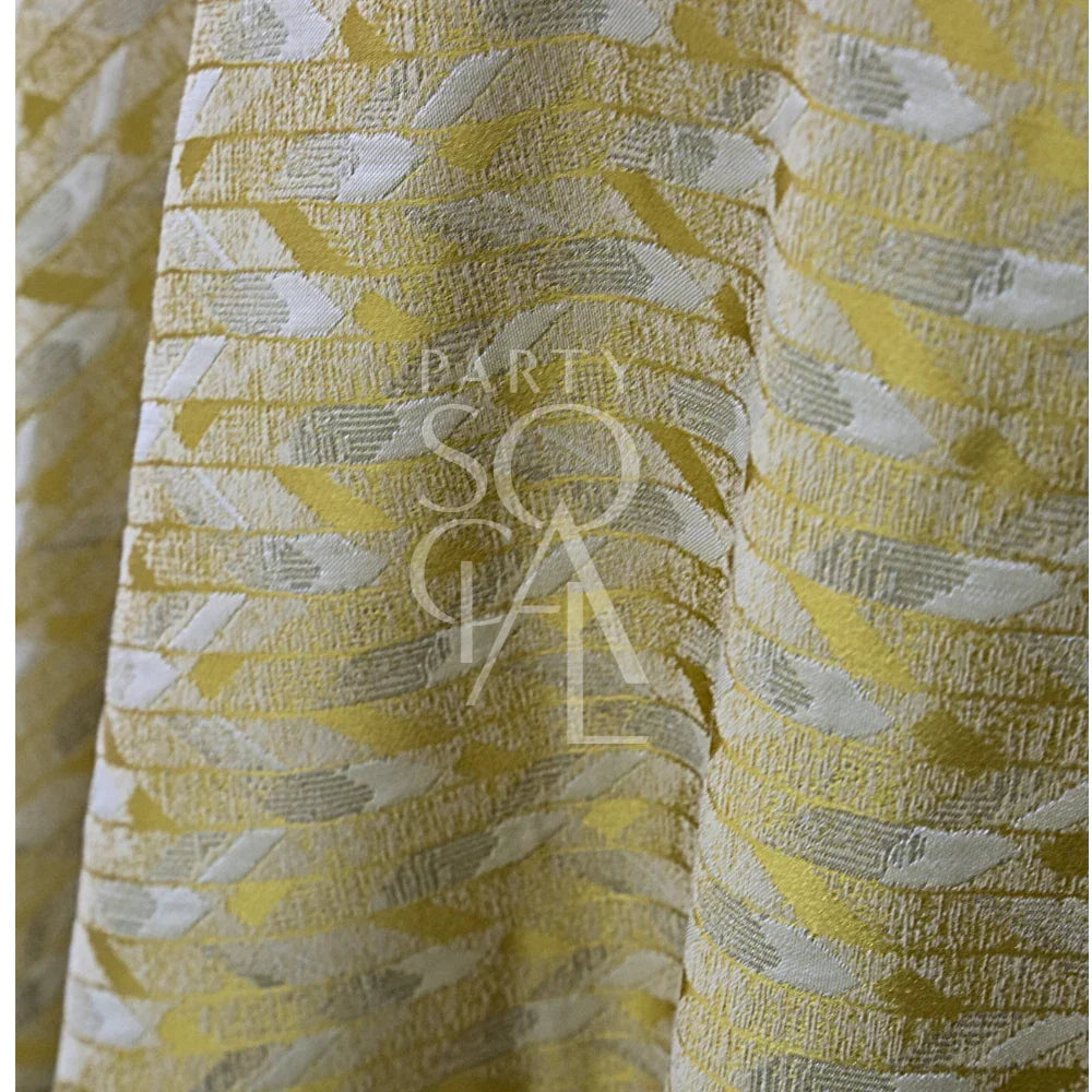 Close-up of the GEOMETRIC YELLOW TABLE CLOTH, featuring a jacquard weave with a subtle wave pattern, ideal for elegant event settings.