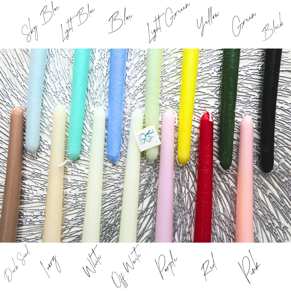 The Tapered Flame Smokeless Candles in 15 hues, elegantly displayed on metallic background; artisan-crafted in Belgium, ideal for enhancing event atmospheres.