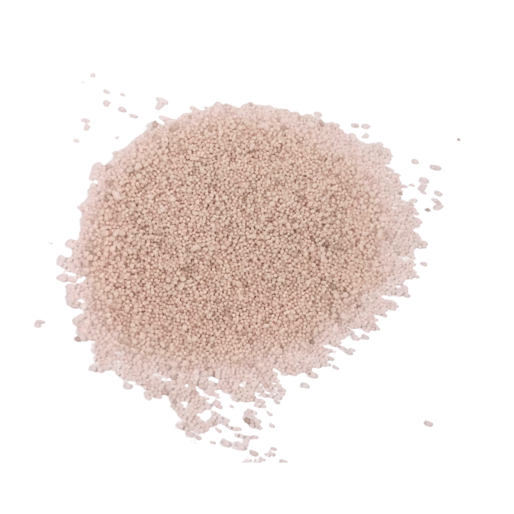 Lumen Sand Wax Candle: A pile of small, beige granules, evoking sunlit dunes, hand-poured for a serene, artisanal ambiance in event settings.