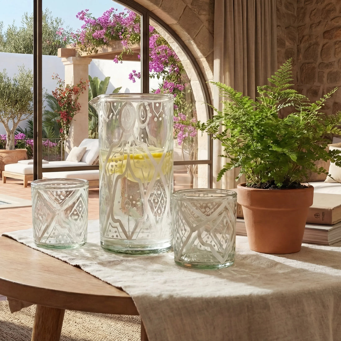 Marrakesh Glassware Gift Box with etched carafe and tumblers on a linen-draped table, perfect for elegant gatherings and Ramadan celebrations.