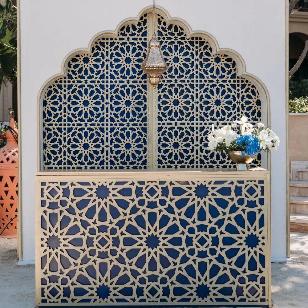 Arabesque Gold Bar Unit with intricate geometric lattice and ornate lantern, set in a garden event, ideal for luxurious Middle Eastern-themed celebrations.