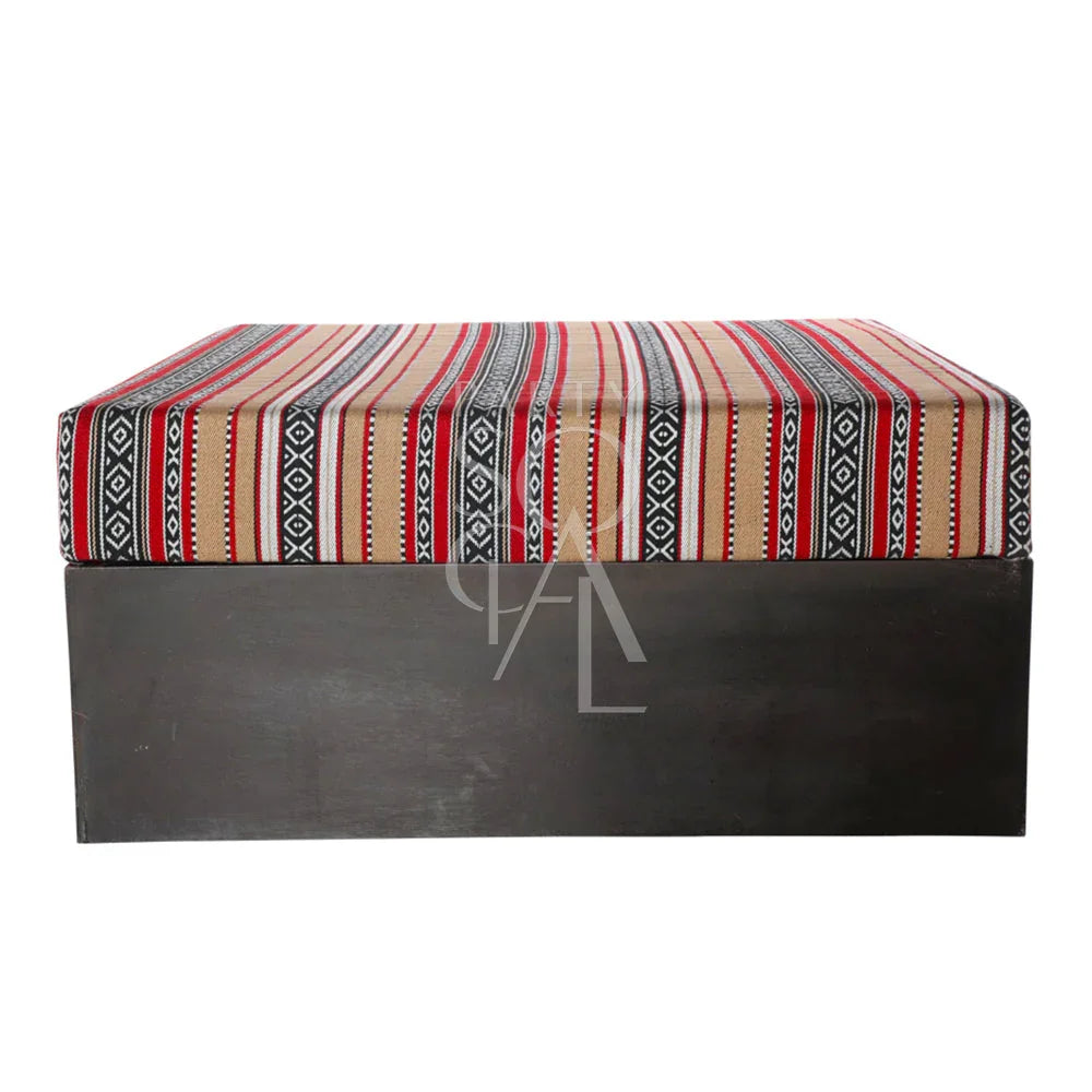 SOFA ISLAND: Modern ottoman with a black and red striped fabric, ideal for lounge seating at events. Dimensions: 100cm L x 100cm W x 45cm H.