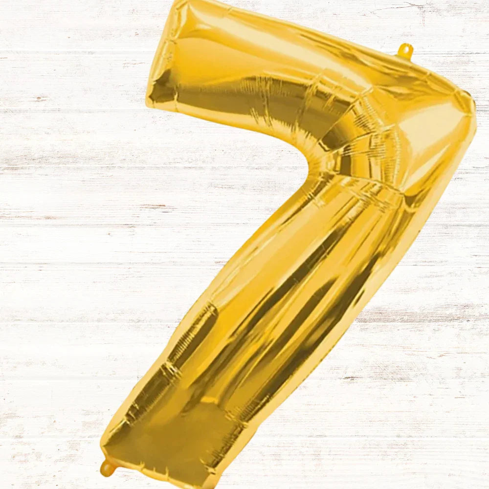 Gold Foil Number Balloon (40inch) shaped like a number seven, perfect for parties and celebrations, displayed on a white surface.