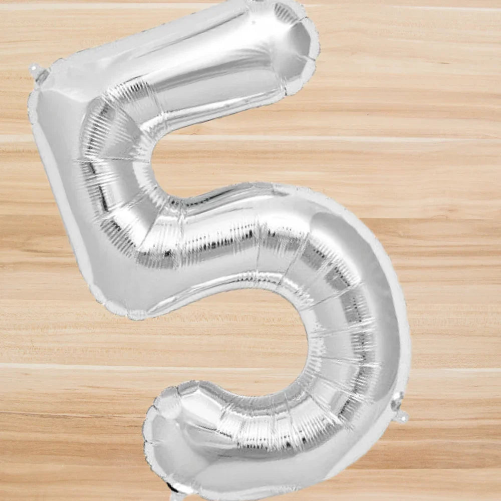 Silver Foil Number Balloon (40inch) on a wooden surface, perfect for parties and events, available in numbers 0-9 for any occasion.