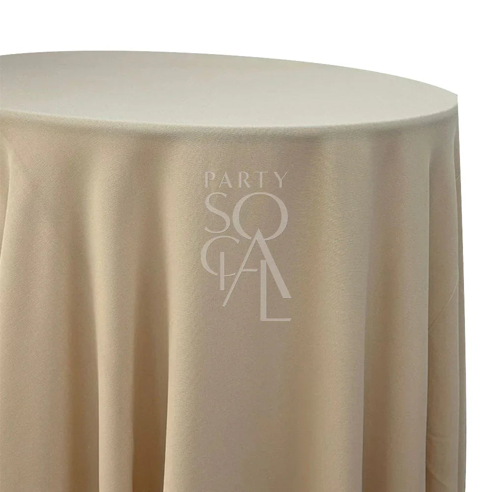 Round tablecloth in premium cotton linen, elegantly draped over a table, ideal for enhancing any special occasion&