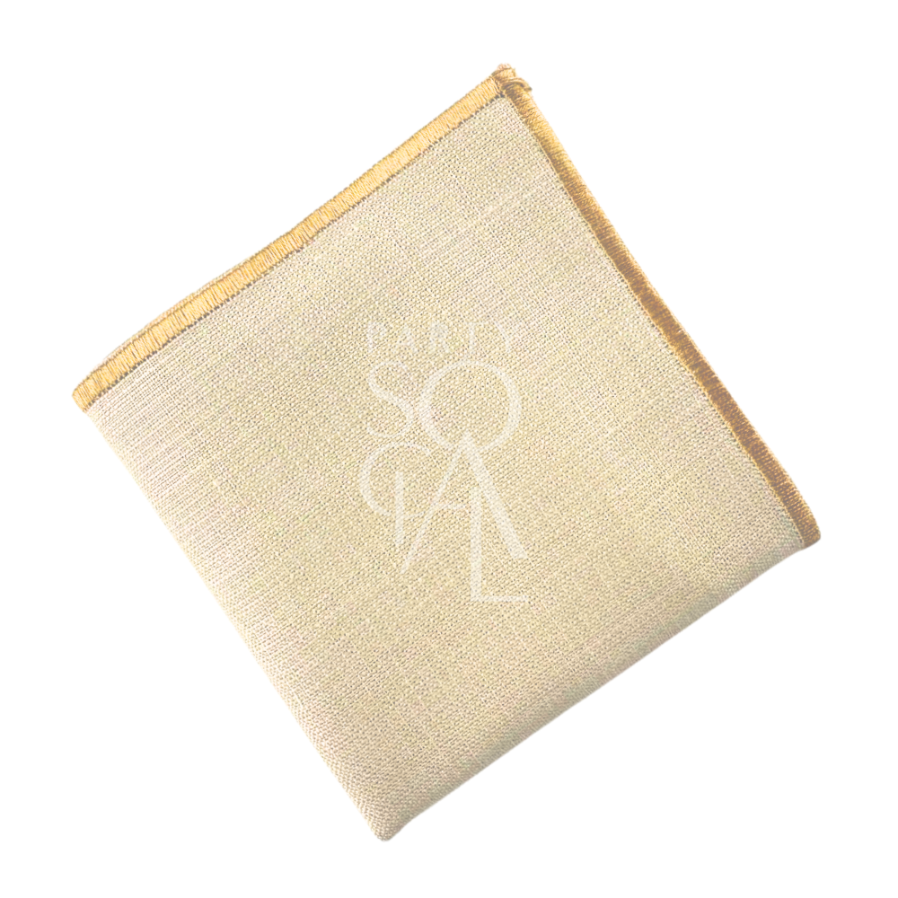 NAPKIN BLEACHED SAND W/ LINE: Close-up of a beige linen blend napkin, ideal for events. Suitable for personalization with a stitched logo.