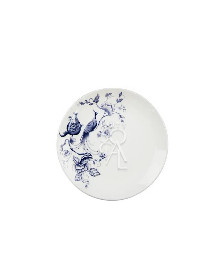 This plate features a classic blue and white porcelain-style design with intricate detailing. It is decorated with elegant bird and floral patterns, where graceful birds with flowing tails are perched among delicate branches and blossoms. The artwork is evenly spread across the surface, creating a balanced and sophisticated look.