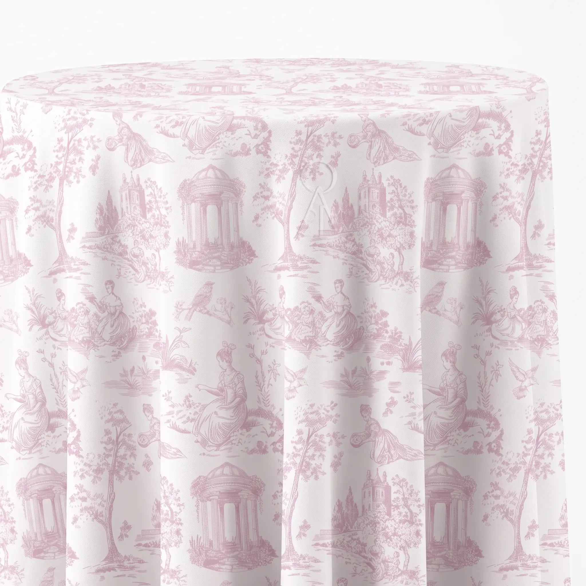 A round table covered with a white tablecloth featuring a light pink classic toile de Jouy pattern with figures, trees, and classical architecture.