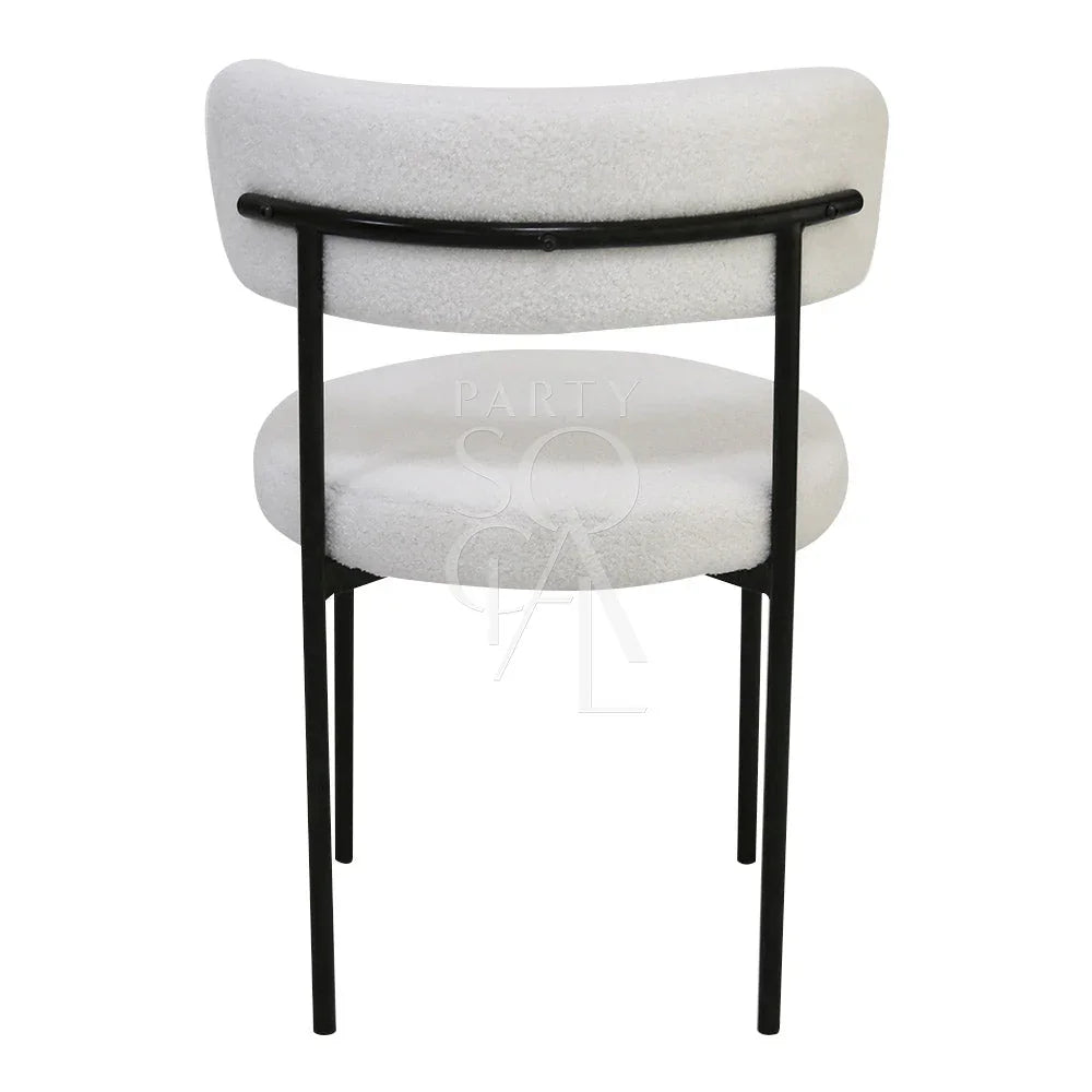 BOUCLE CHAIRS: White chair with black legs, ideal for weddings and corporate events, reflecting Party Social&