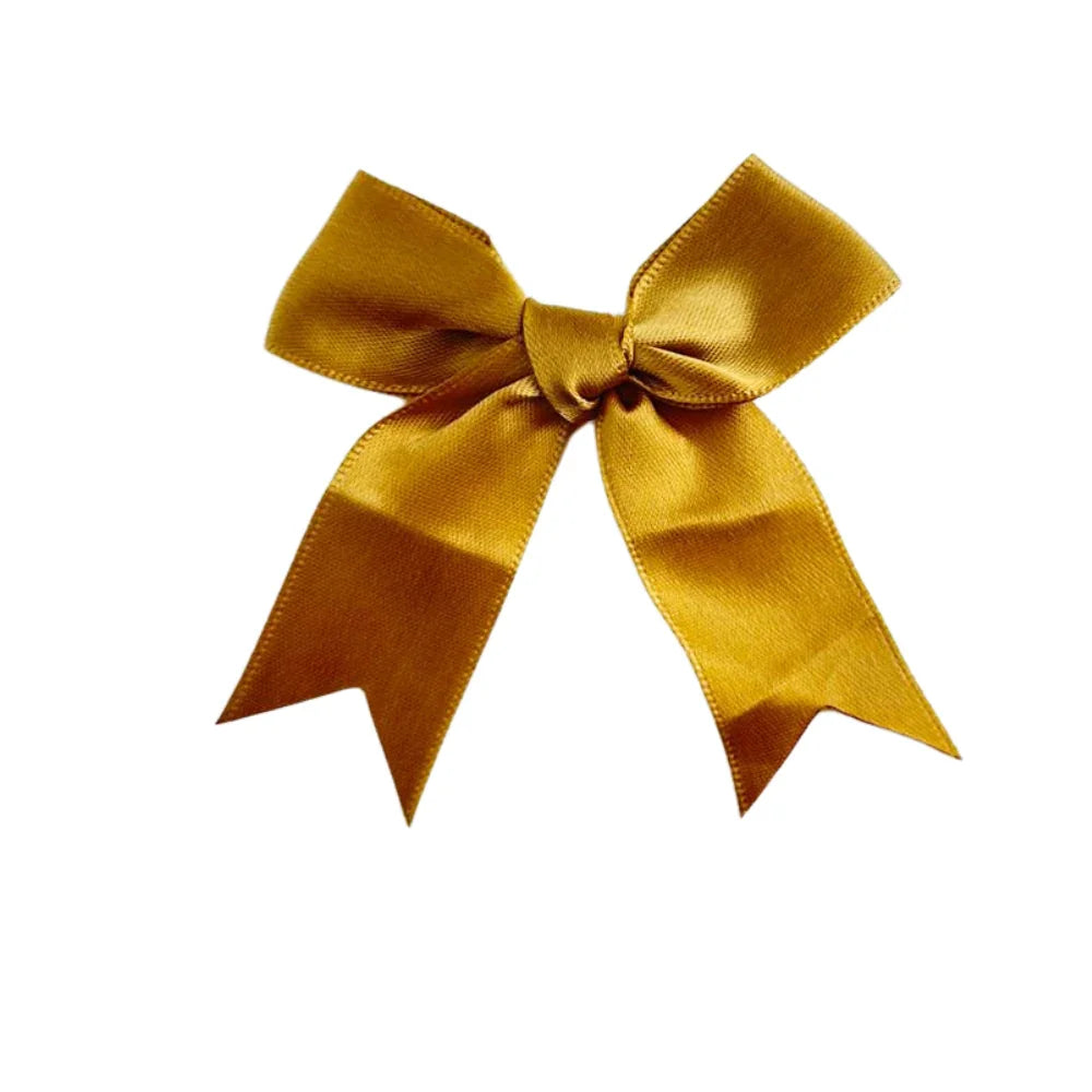 Gold Bow for party decorations, showcasing detailed craftsmanship with intricate ribbon and bow design, perfect for enhancing any event&
