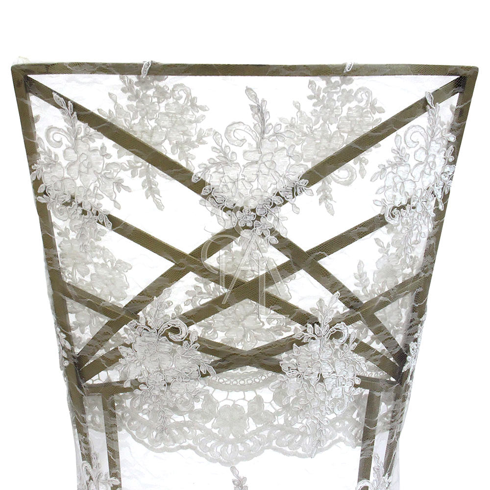 CHAIR COVER FULL LACE CHAMELEON displayed on a Chameleon chair, showcasing intricate lace detail, ideal for elegant event settings. Available exclusively with Chameleon chair rental.