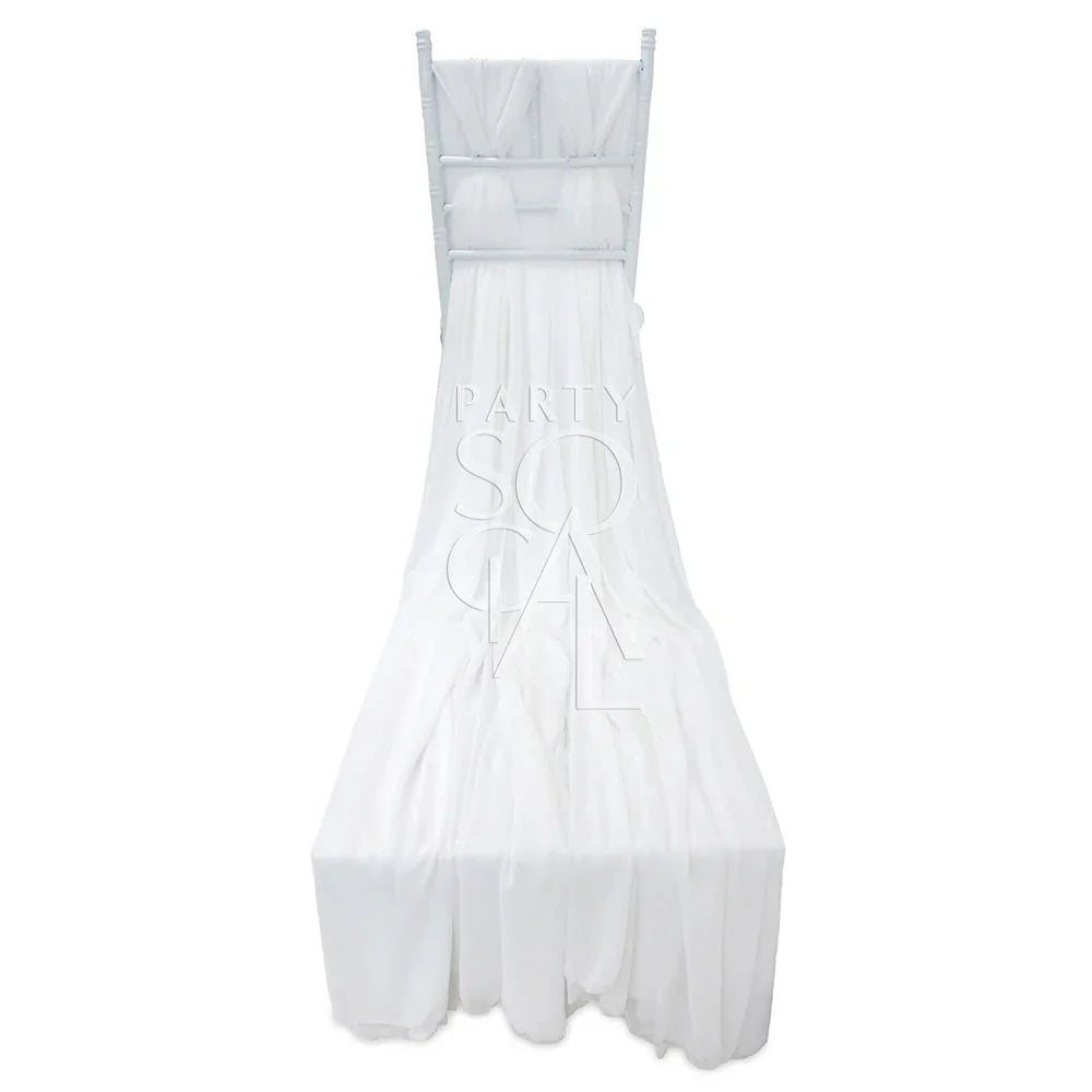 White chiffon chair cover with a train for Chiavari chairs, offering an elegant and whimsical touch for event seating.
