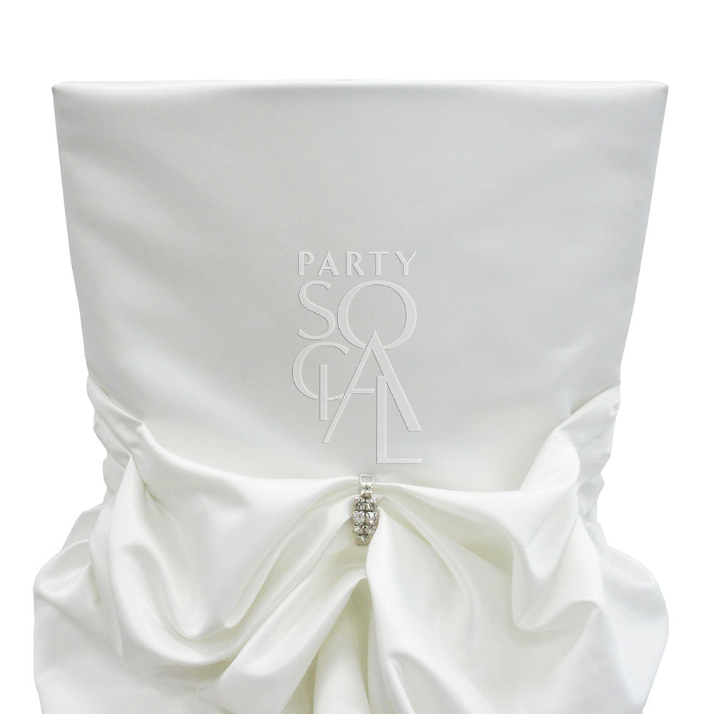 CHAIR COVER OFF WHITE SATIN DRAPED CHAMELEON with a decorative bow, designed for Chameleon chairs, perfect for elegant events and available exclusively with chair rental.