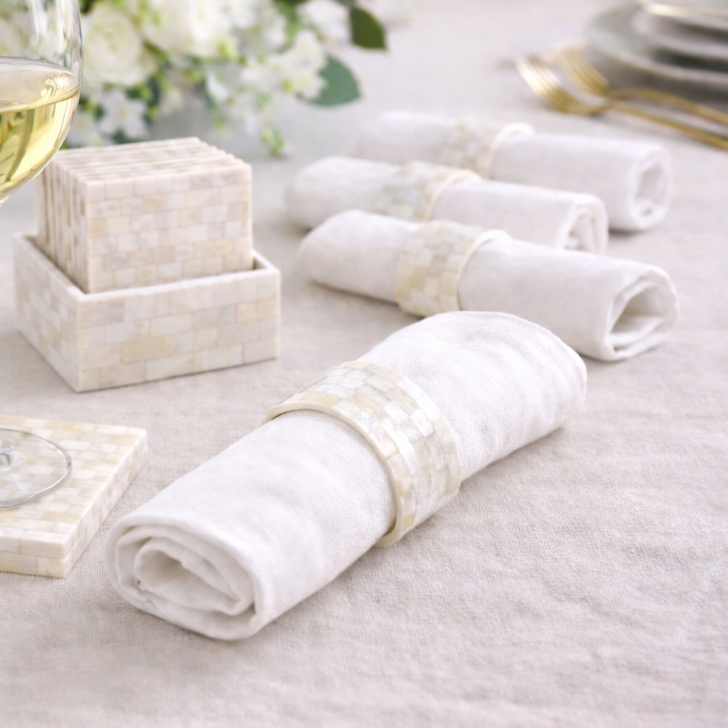 The Crescent Pearl Entertaining Set features mosaic-patterned napkin rings and coasters, perfect for elegant table settings and luxury Ramadan gifting.