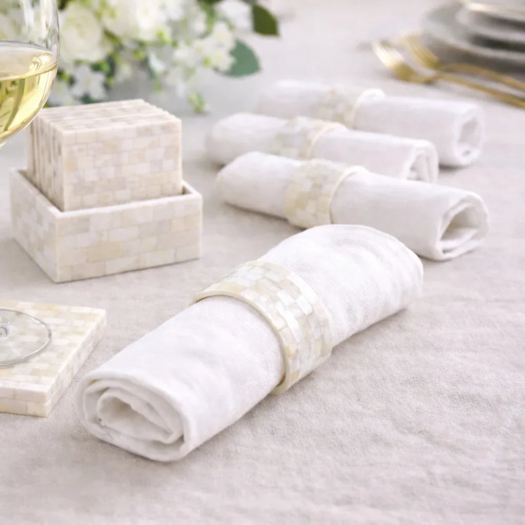 The Crescent Pearl Entertaining Set features mosaic-patterned napkin rings and coasters, perfect for elegant table settings and luxury Ramadan gifting.