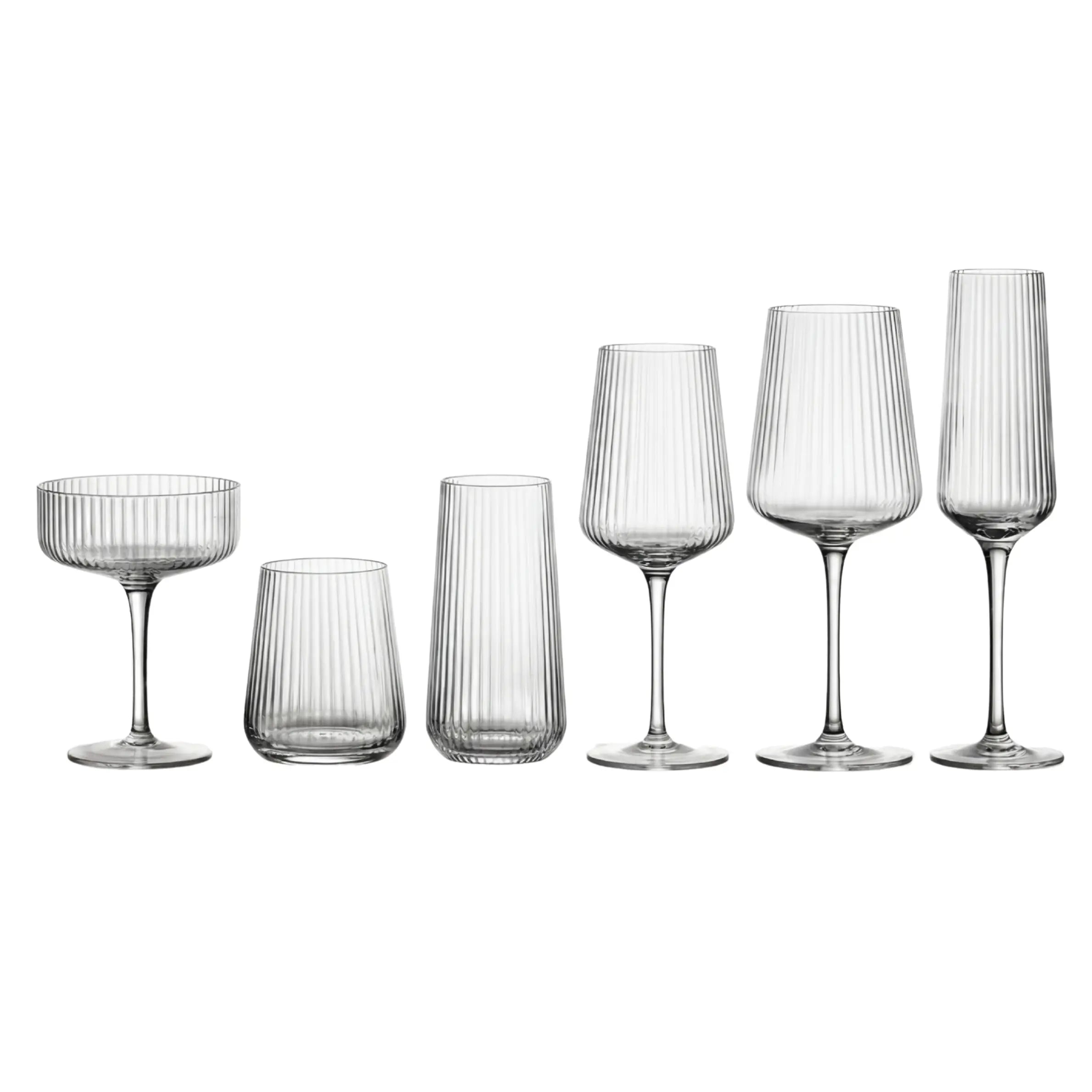 Clear Lined Glassware Collection: Six elegantly ribbed glasses including coupe, tumblers, wine glasses, and champagne flute, perfect for upscale events and entertaining.