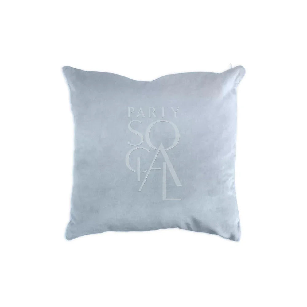 CUSHION COVER VELVET: A white velvet cushion cover featuring a stylish logo, perfect for enhancing party decor with a touch of elegance.