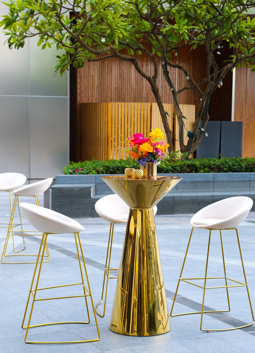 CREAM AND GOLD BASE BAR STOOL with elegant velvet upholstery and gold legs, perfect for weddings and events, enhancing stylish seating arrangements.