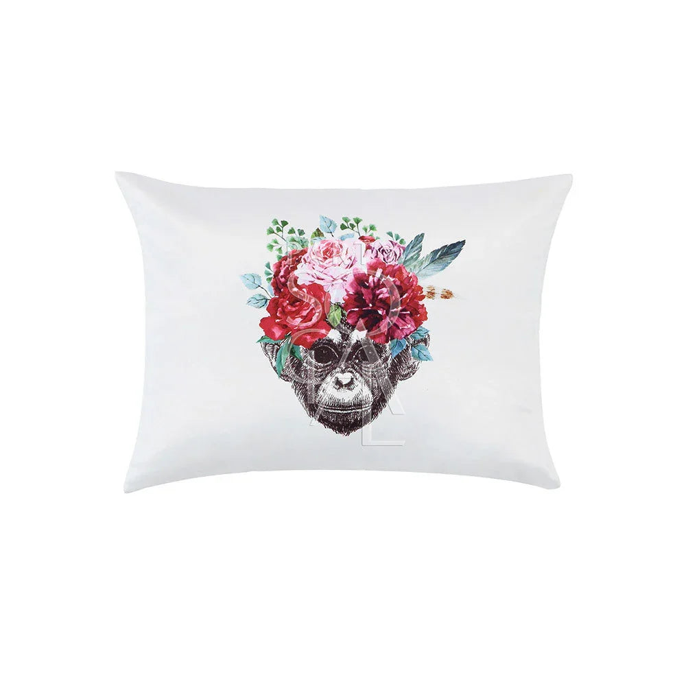 CUSHION OFF WHITE W/ MONKEY FACE: Satin throw pillow featuring a central monkey face surrounded by floral designs. Ideal for party-themed decor or event settings.