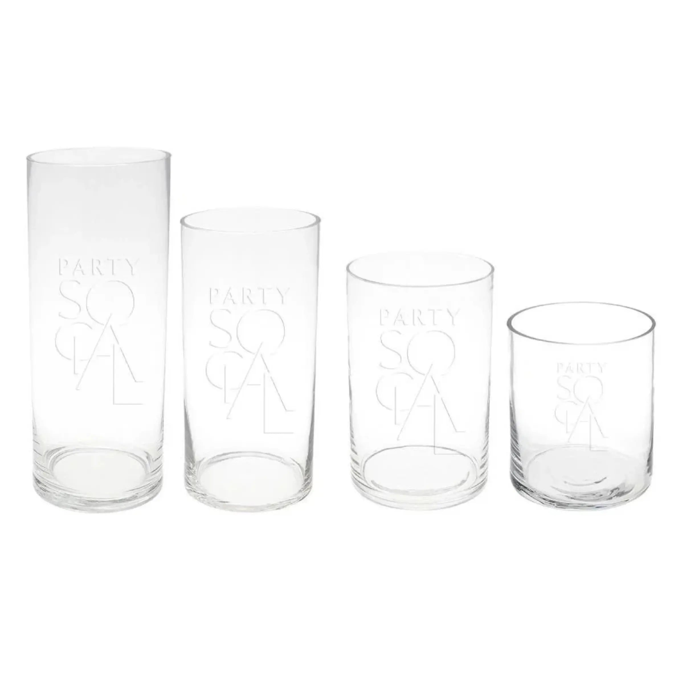 A group of elegant cylinder glass vases, perfect for brightening tables or consoles. Versatile sizes available: Extra Small, Small, Medium, Large. Candles sold separately. Tableware from Party Social Dubai.