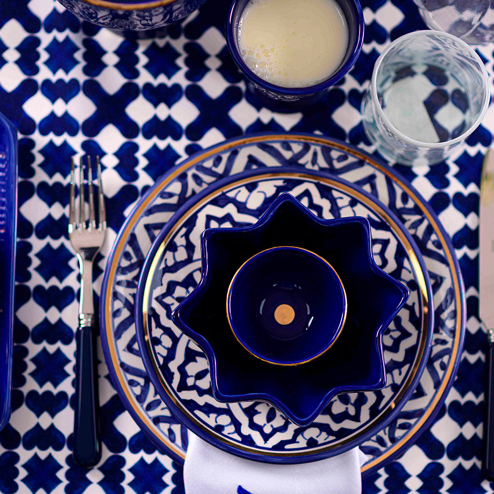 Marrakesh Linen Tablecloth set with tableware and kitchen utensils, perfect for any meal or event.