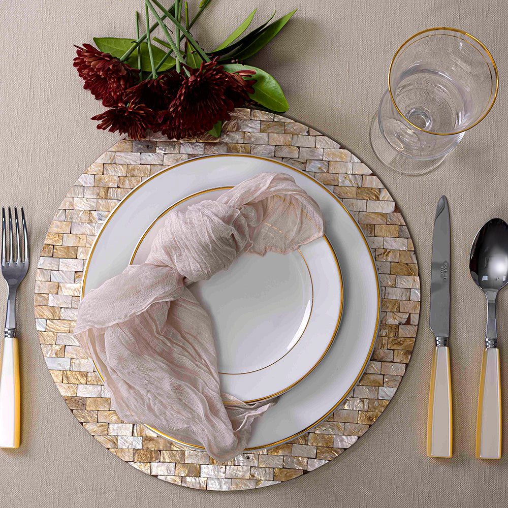 Round Shell Placemat displayed with table setting, glass, and knife close-ups.