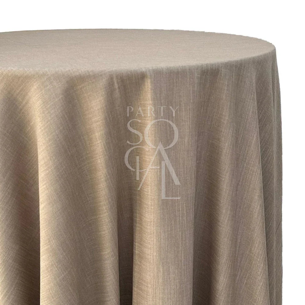 Round tablecloth linen blend, elegantly covering a table, suitable for various special occasions, offered by Party Social for event settings.