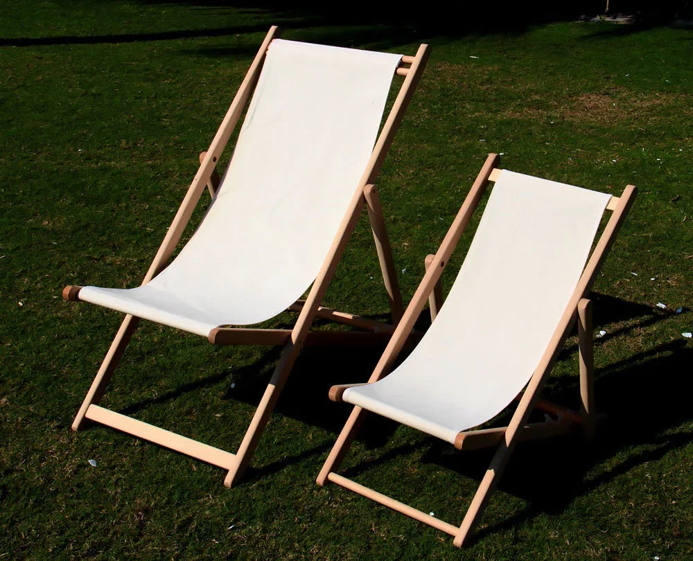 Wooden deckchairs on grass, ideal for outdoor events, complementing a cinema screen setup for Party Social gatherings. Perfect for both adults and children.