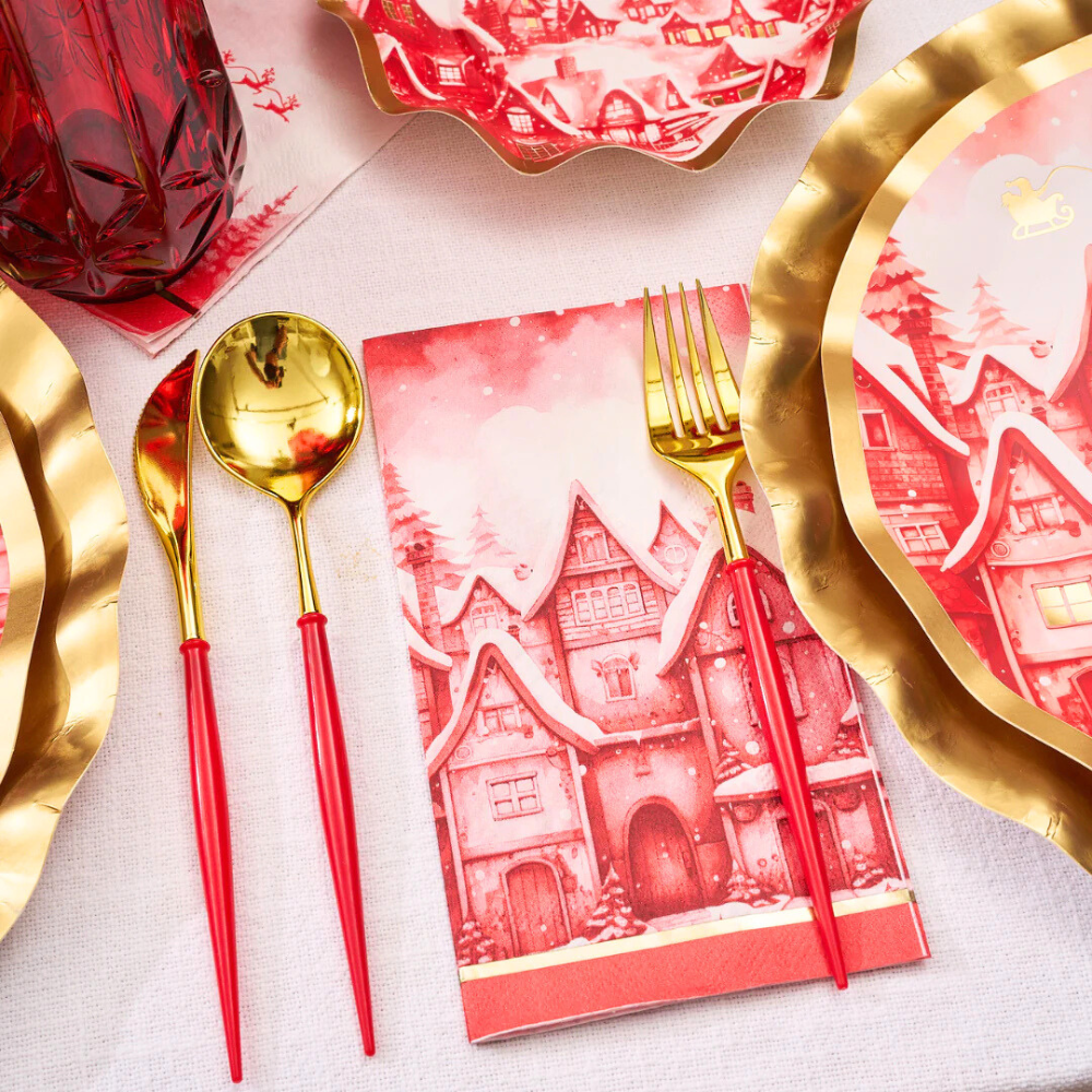 Christmas Village Guest Towel Napkins arranged with elegant tableware, enhancing party decor with festive charm.