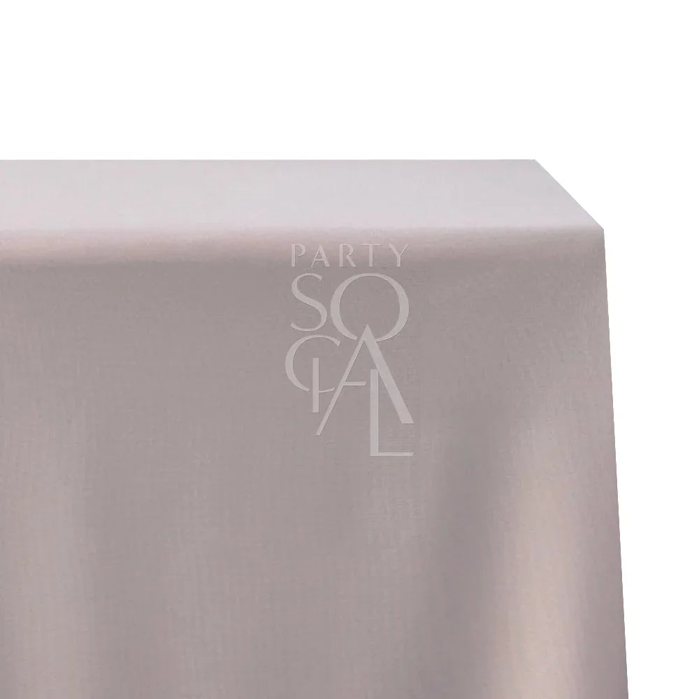 Rectangular tablecloth in cotton linen featuring a subtle logo, perfect for enhancing any special occasion setting.