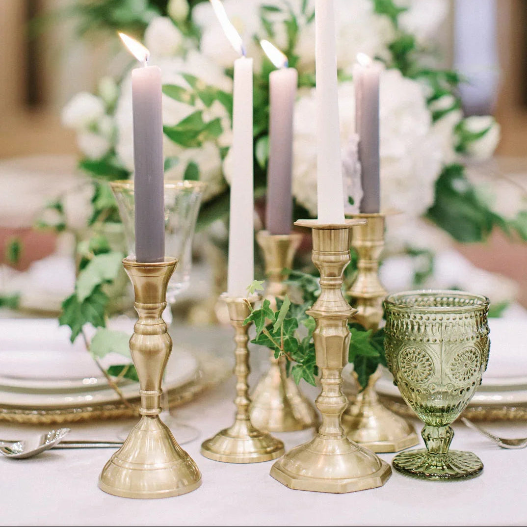 BRASS CANDLESTICKS SET OF 3 displayed as a centerpiece on a table, featuring matte brass finish, ideal for rustic or premium events.