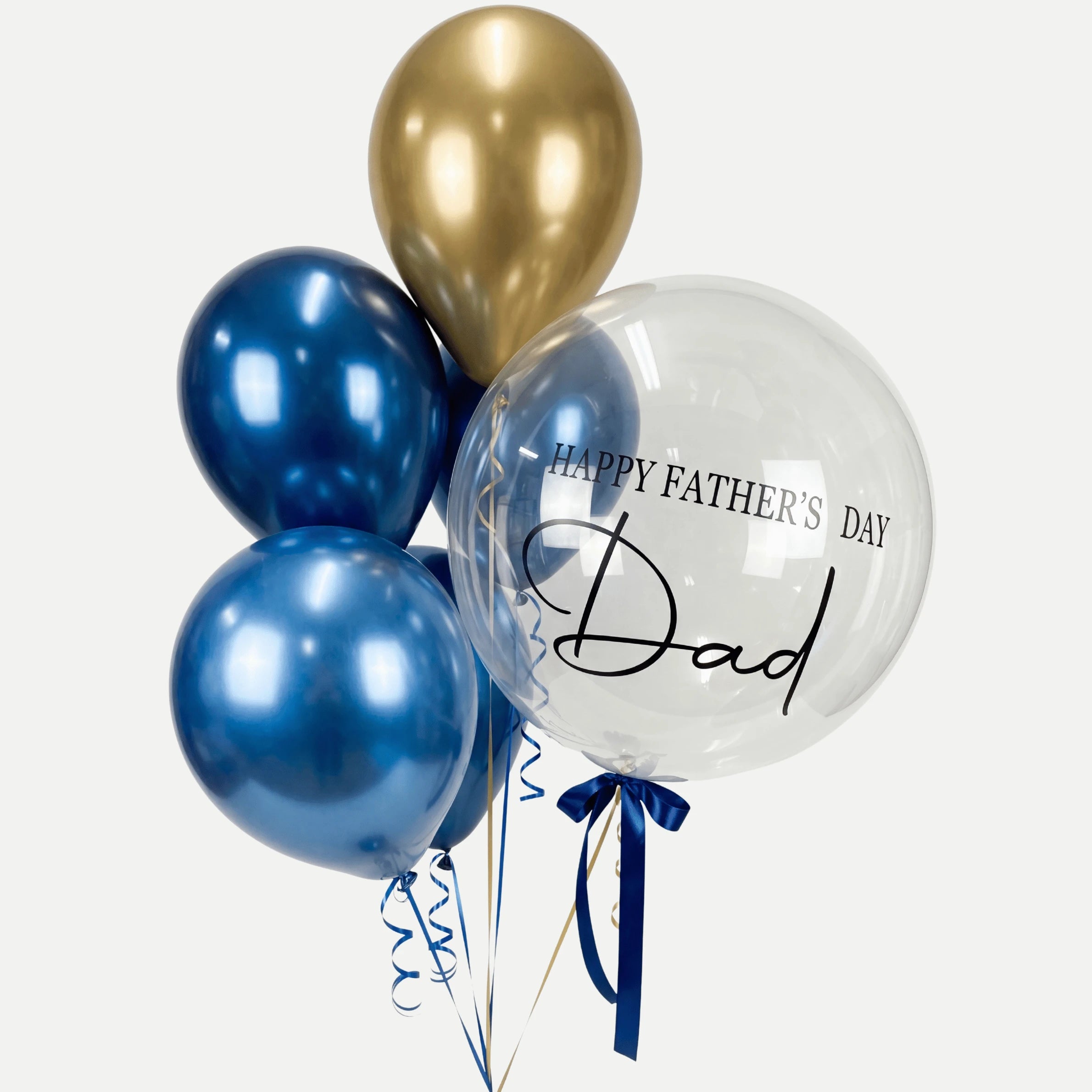 Balloon bouquet with gold and blue balloons and a clear balloon with &