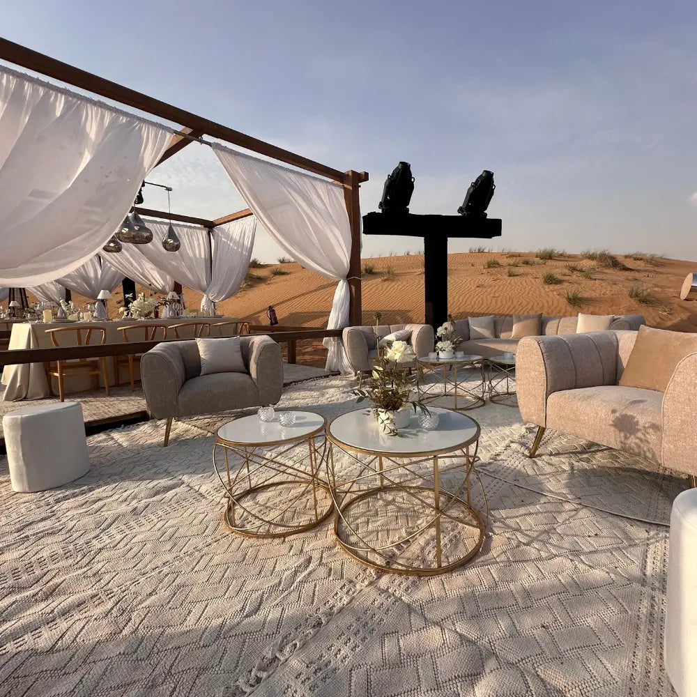 GOLD WIRE WITH MARBLE TOP COFFEE TABLE showcased in a stylish desert lounge setup, ideal for elegant events or sophisticated home gatherings.