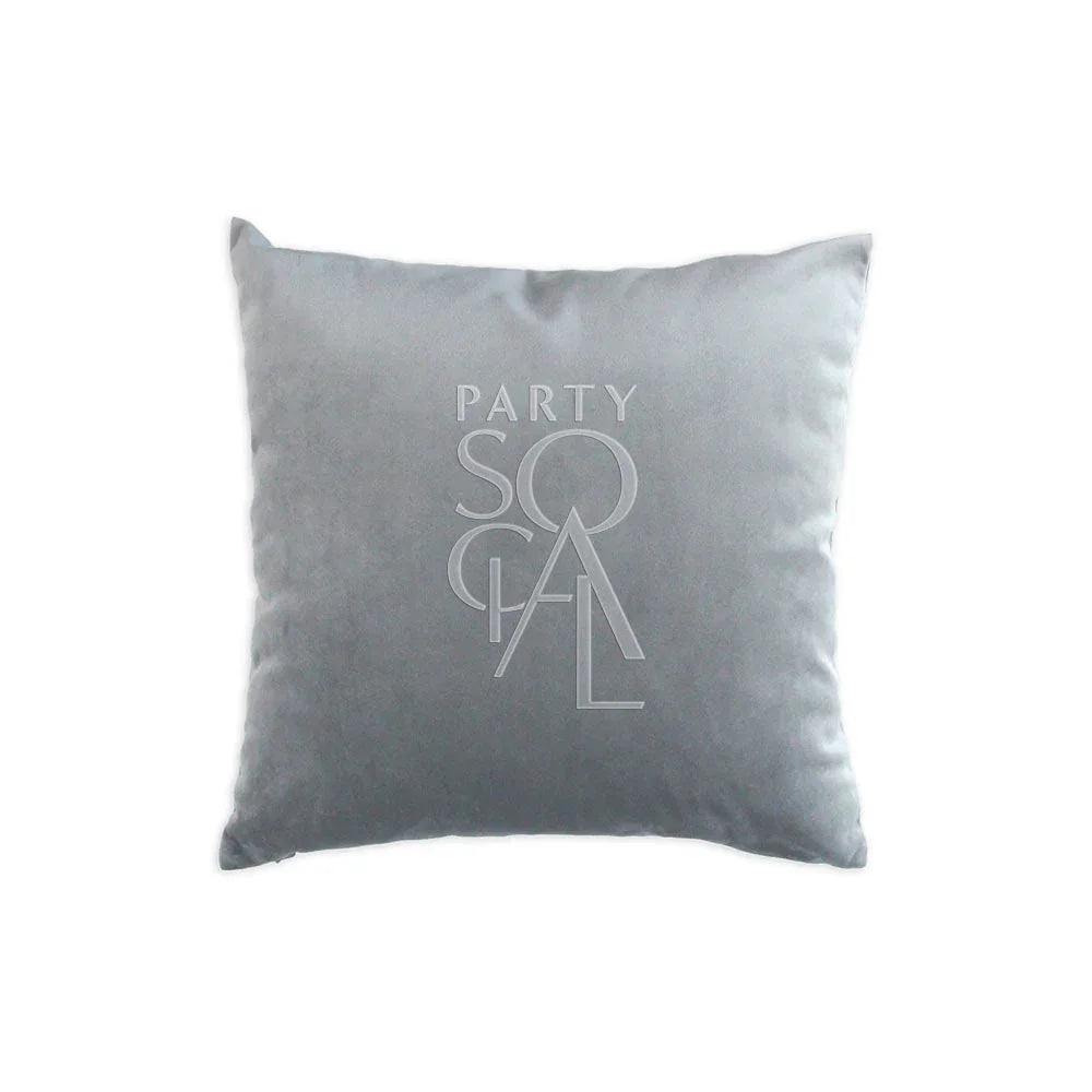CUSHION COVER VELVET: Grey pillow featuring a logo, crafted from soft premium velvet fabric, ideal for adding elegance to events or home decor.