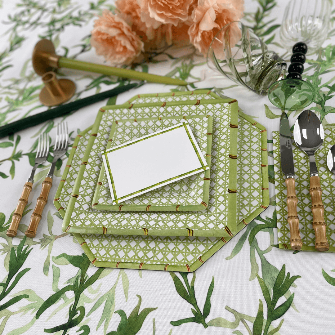 Holly Trellis Square Paper Salad & Dessert Plates, set of 8, displayed on a floral table setting with matching cutlery and tablecloth.
