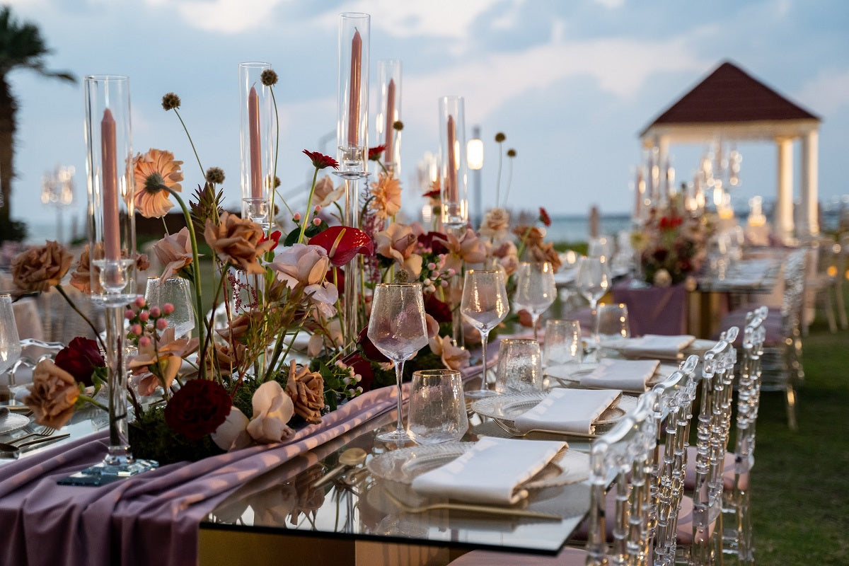 Gold Rimmed Geometric Glasses on an elegantly set dinner table with flowers and candles, ideal for enhancing premium event settings.